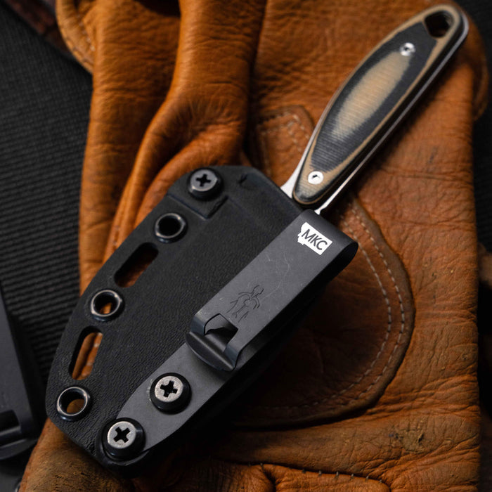 Kydex sheath for BADROCK knife featuring secure attachment points and durable design, ideal for outdoor and tactical use.