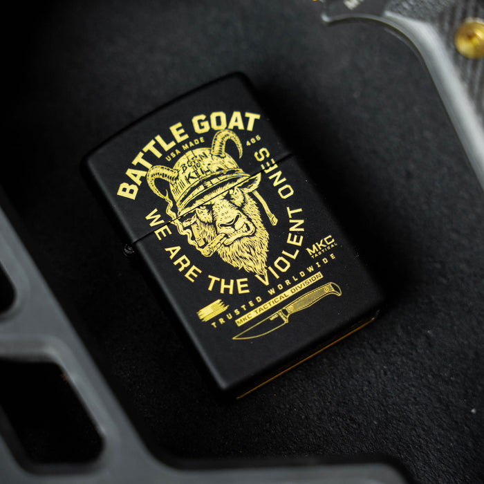Black Zippo lighter featuring a gold graphic of a lion wearing a helmet with the text "BATTLE GOAT" and "WE ARE THE VIOLENT ONES.