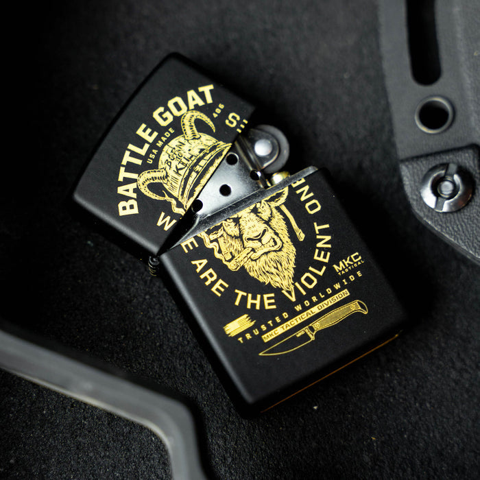 Black Zippo lighter featuring a gold Battle Goat design and the phrase "We Are the Violent Ones" from Montana Knife Company.