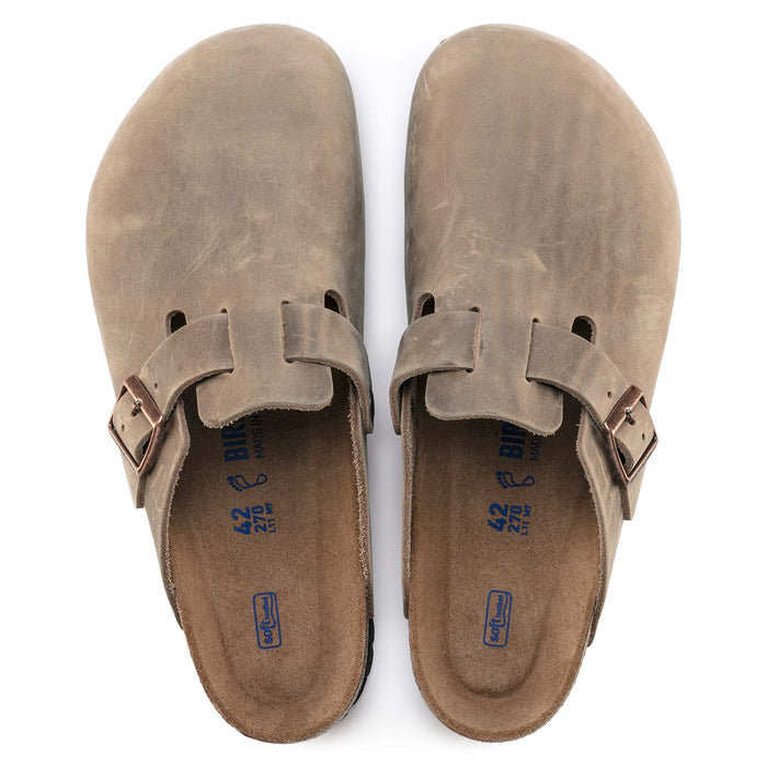 Top view of Birkenstock Boston Soft Footbed clogs in Tobacco brown leather with cork footbeds and adjustable buckle straps.