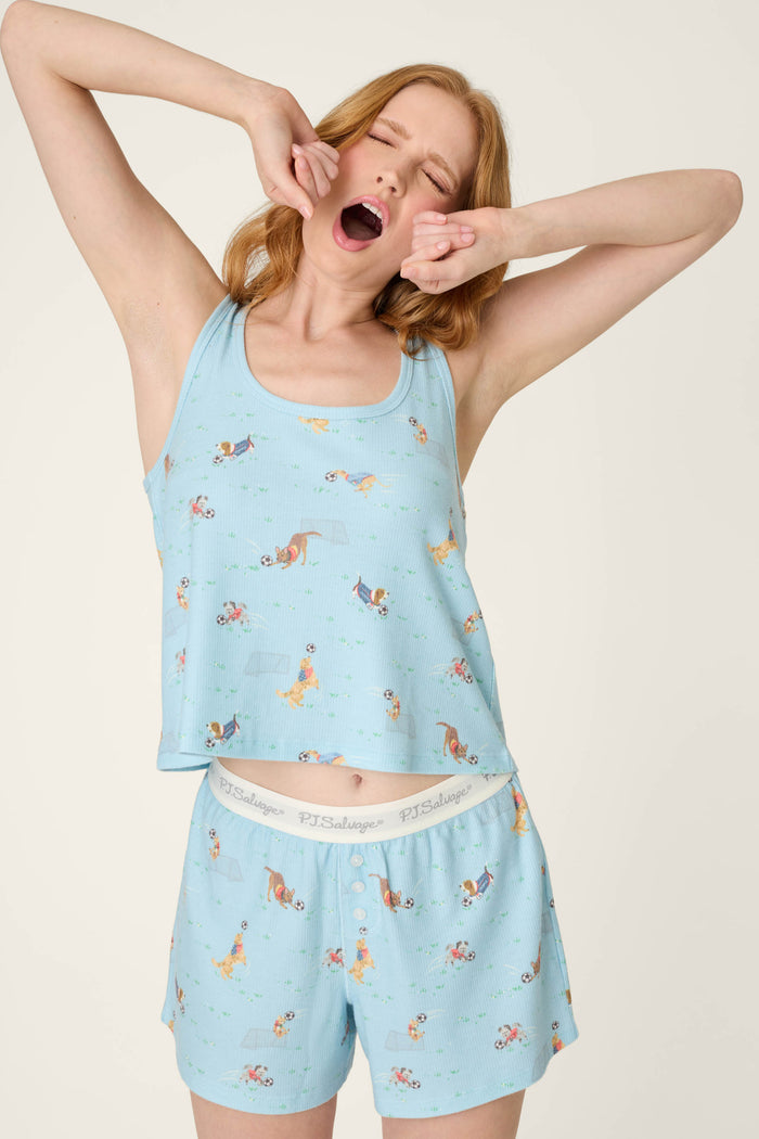 A light blue fabric with a playful dog print and soft texture, featuring gentle stretch and a comfortable, elastic feel.