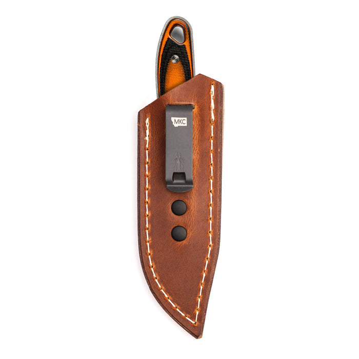 Brown leather sheath for concealed pocket carry, featuring a secure clip and contrasting stitching for durability.