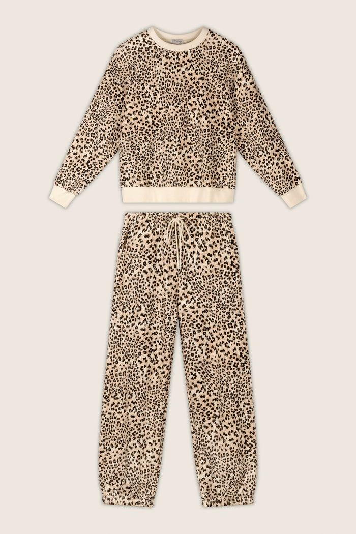 P.J. Salvage "C'est La Vie Leopard Print Frankie Sweater" two-piece lounge set, featuring a long-sleeve top and matching drawstring pants with a beige background and black leopard print, laid flat on a light surface.