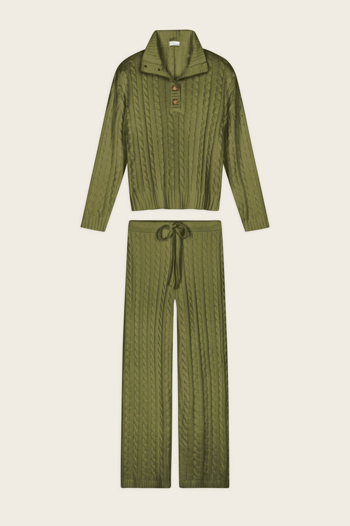 The Cozy Chenille Cable Knit Olivine Pullover Lounge Set by P.J. Salvage features a two-piece design in olive green, including a long-sleeve collared button-up top and matching drawstring pants, both showcasing a stylish cable-knit pattern.