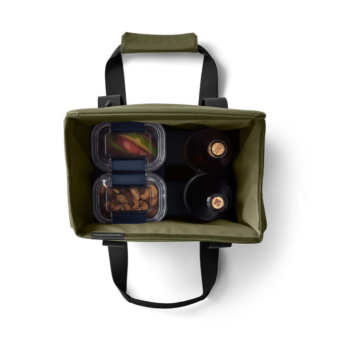 Top view of the open YETI Daytrip 14L Tote Bag in Olive filled with snacks and two wine bottles.