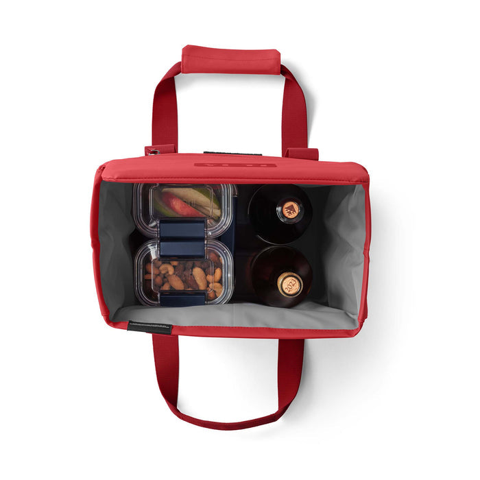 Top-down view showing the tote filled with two wine bottles and food containers.