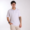 Man wearing a purple and white striped polo.