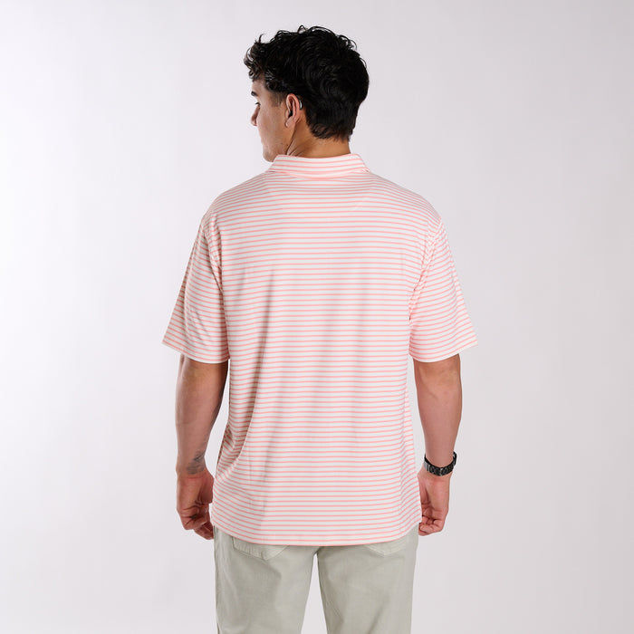 Back of man wearing a peach and white polo.