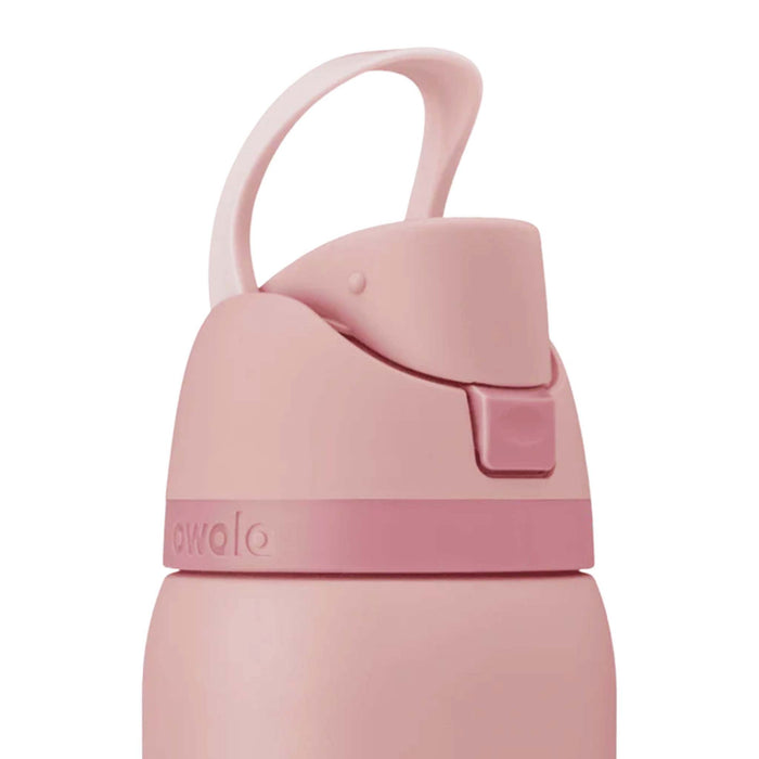 Close-up of Owala FreeSip lid in Rose Quartz with carry loop flipped up.