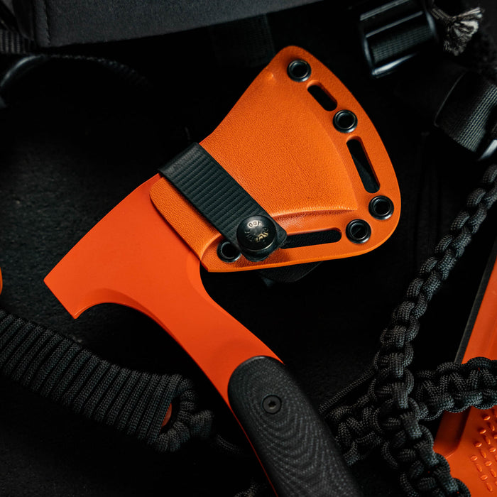 HELLGATE HATCHET with an orange Kydex sheath, showcasing its durable design for outdoor and tactical use.