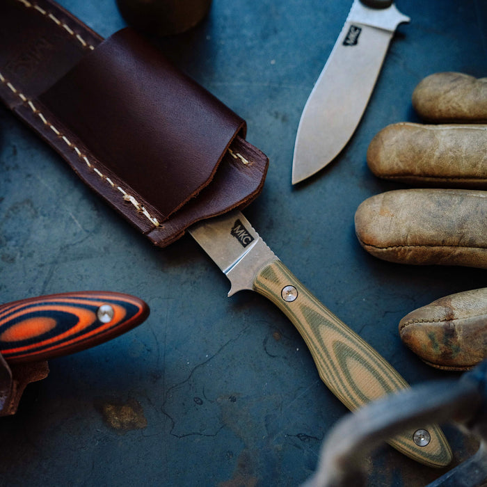 Horizontal leather sheath for JACKSTONE knife, featuring durable construction and stylish design, ideal for outdoor use.