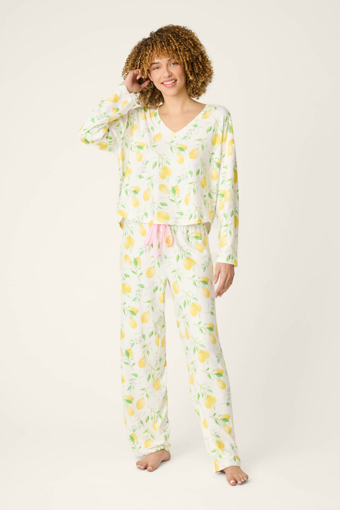 Fabric features a vibrant lemon print on a light background with accents of pink, including a textured pink drawstring detail.