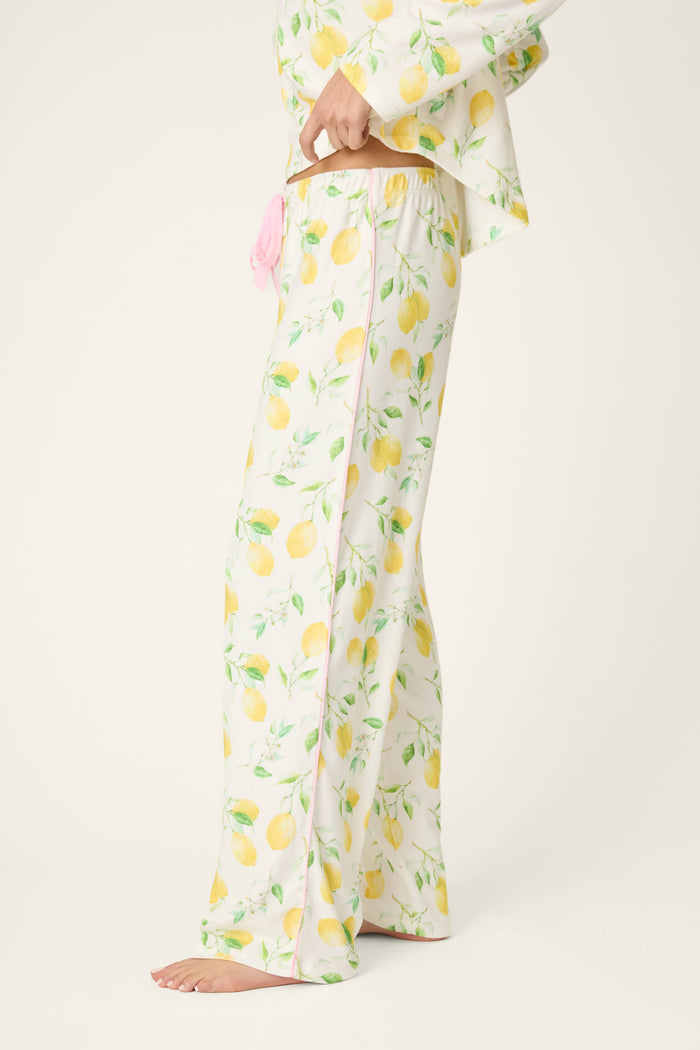 Fabric features a yellow lemon and green leaf print on a light background, with a soft, smooth texture.