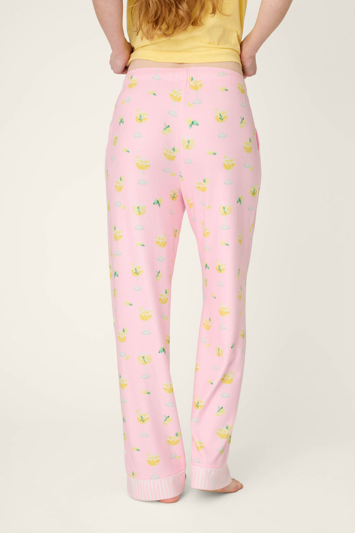 Yellow and green fruit print fabric with ribbed ankle cuff texture.