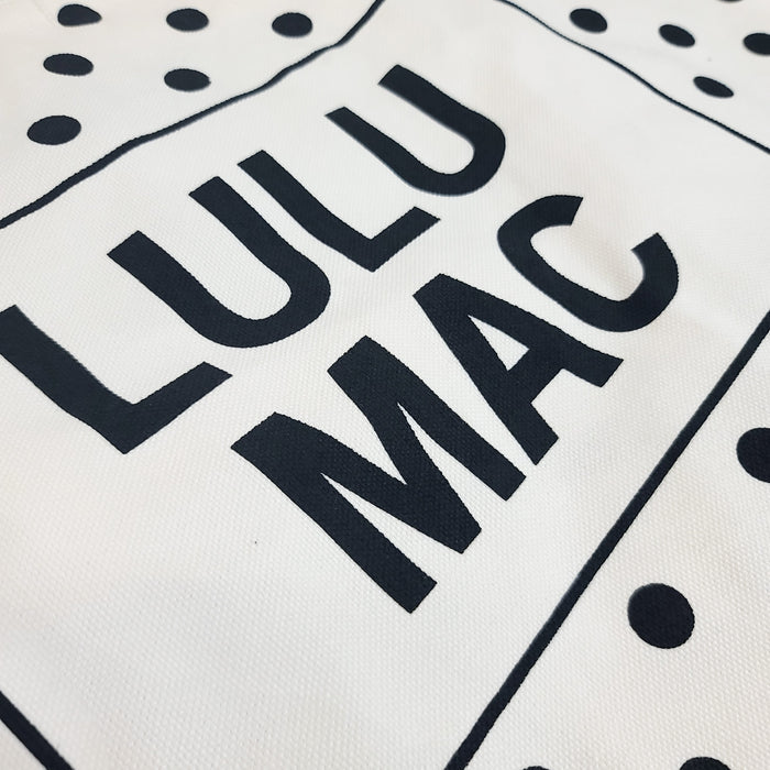 White/Black | White canvas tote bag with black polka dot pattern and 'LULU MAC' branding on a white background