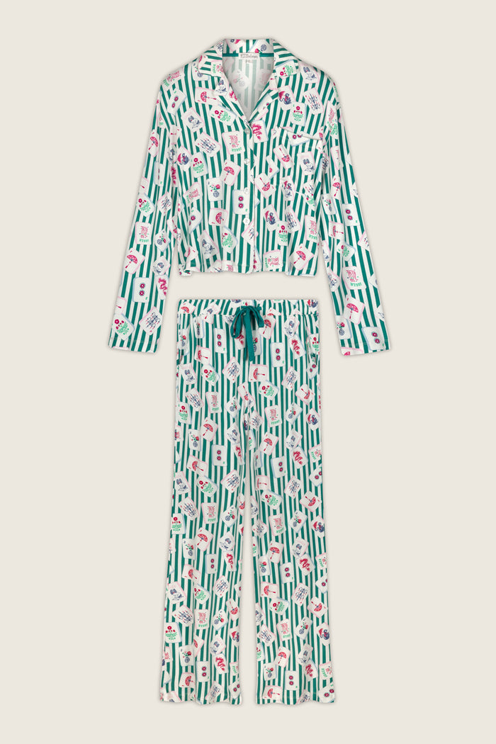 Introducing the Mahjong Queen Dreams Mahjong Print Long PJ Set by P.J. Salvage—this two-piece women’s pajama set features a button-up long-sleeve top and drawstring pants adorned with a green and white vertical stripe pattern accented by delicate red and pink florals. Crafted from ultra-soft modal jersey, it offers the perfect blend of cozy comfort and chic style.
