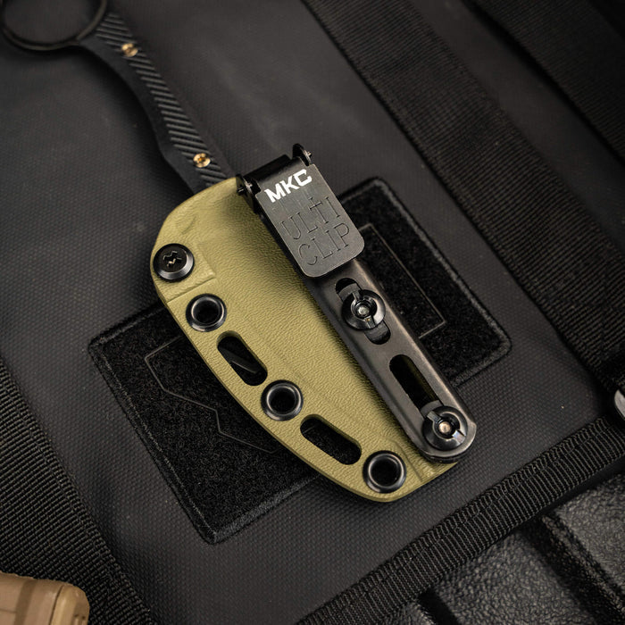Kydex sheath for the Mini Wargoat knife featuring a durable design and adjustable clip for secure attachment.