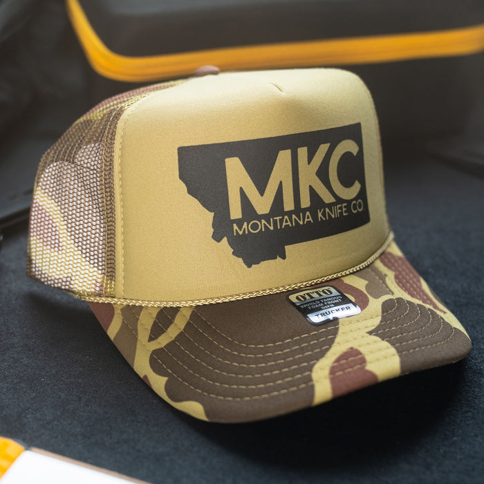 MKC Big State Logo Duck Camo Foam Hunter Hat featuring a Montana outline and camouflage design, ideal for outdoor enthusiasts.