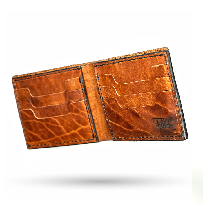 MKC Bison Skull leather wallet showcasing a rich brown interior with multiple card slots and a durable design.