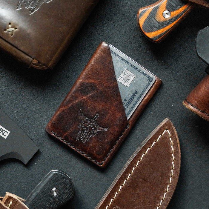 Mini leather wallet featuring a bison skull design, ideal for carrying cards and cash, crafted by Montana Knife Company.