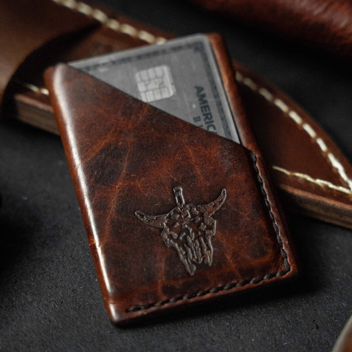 Mini leather wallet featuring a Bison skull design, crafted for durability and style, ideal for everyday carry.