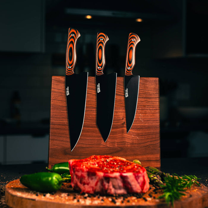 MKC Culinary double-sided knife stand in dark wood finish displaying three knives with vibrant handles beside a steak.