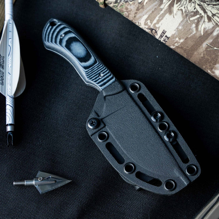 MKC Elk Knife Live Wild Edition in grey and black with a textured handle and sheath, ideal for outdoor enthusiasts.