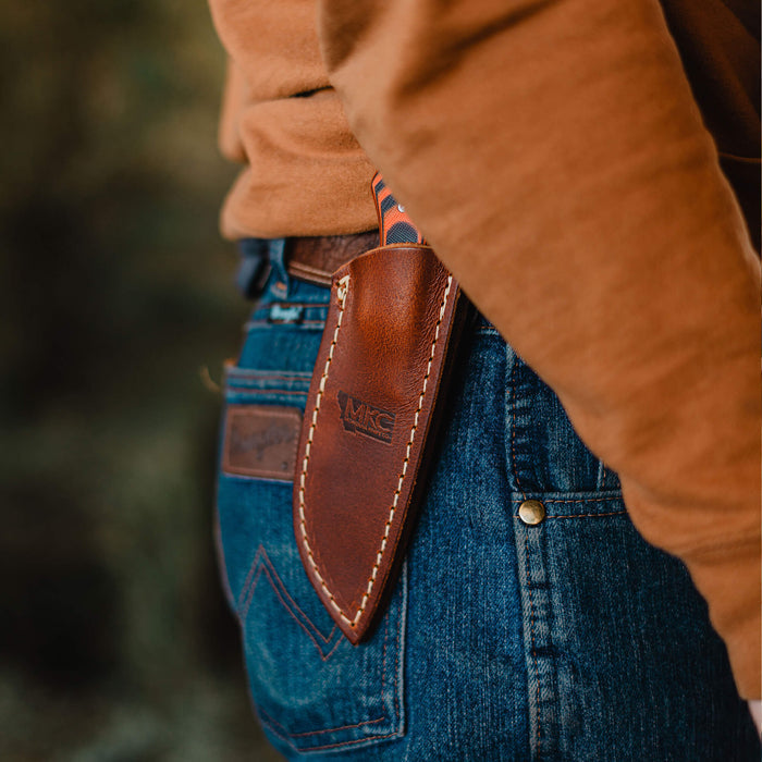 Leather sheath for MKC Elk Knife, designed for vertical belt carry, showcasing durability and practicality for outdoor use.