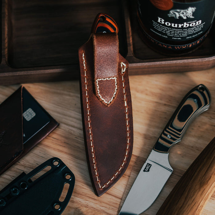 MKC Elk Knife leather sheath designed for vertical belt carry, showcasing premium craftsmanship and durability.