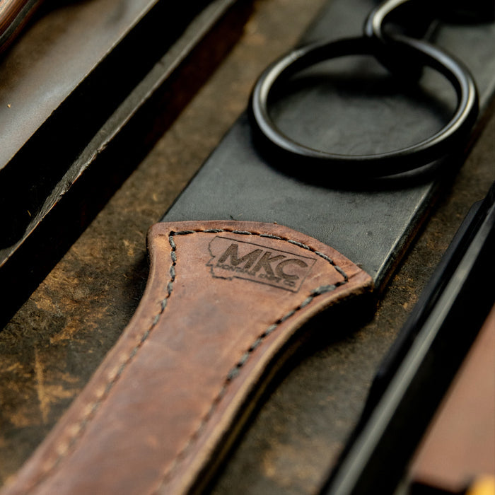 MKC Leather Strop featuring a durable leather handle and metal ring, designed for sharpening knives, made in the USA.