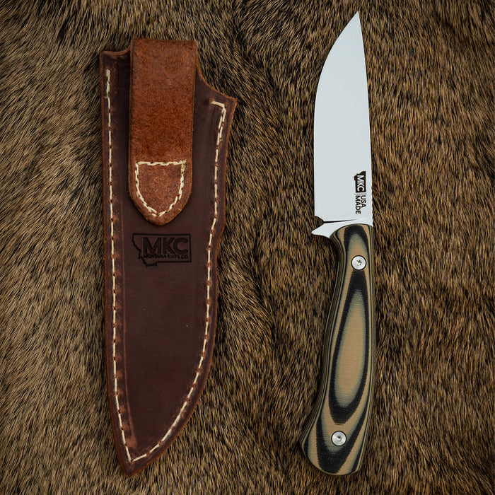 Vertical leather sheath for MKC Whitetail knife, featuring a sleek design and durable materials, ideal for outdoor use.