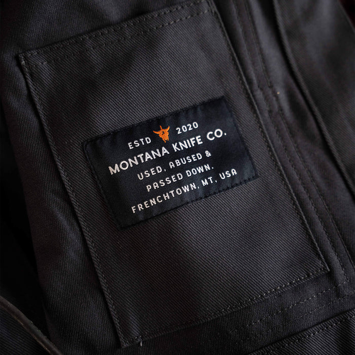 Charcoal MKC Work Jacket featuring a label that reads Montana Knife Co. and indicates it is USA made.