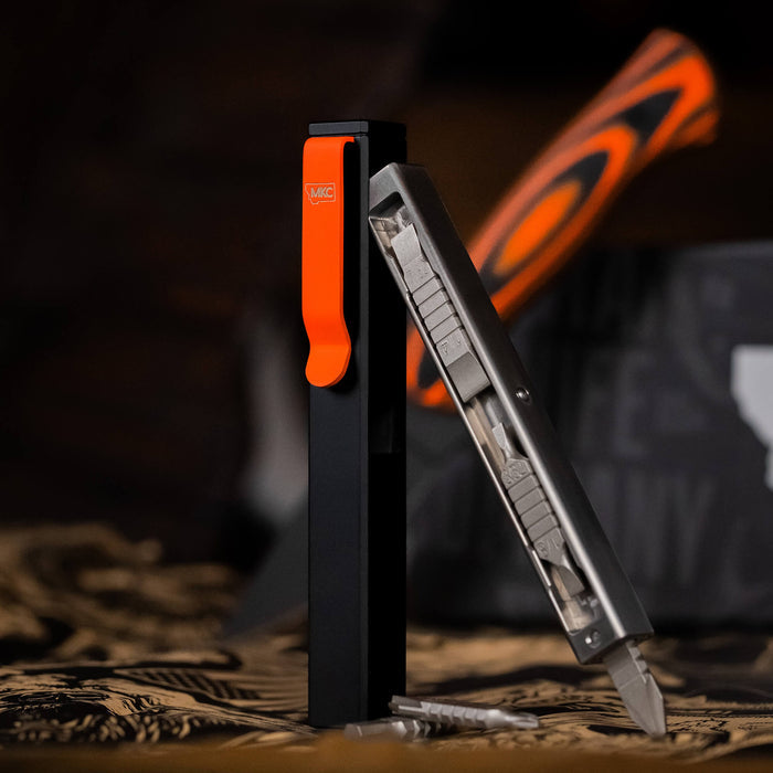 MKC X BIG IDEA DESIGN BIT BAR INLINE MAX, featuring a sleek black and orange design with replaceable bits, ideal for everyday carry.