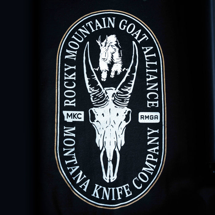 Black t-shirt featuring the Rocky Mountain Goat Alliance logo with a goat illustration and skull design, representing Montana Knife Company.