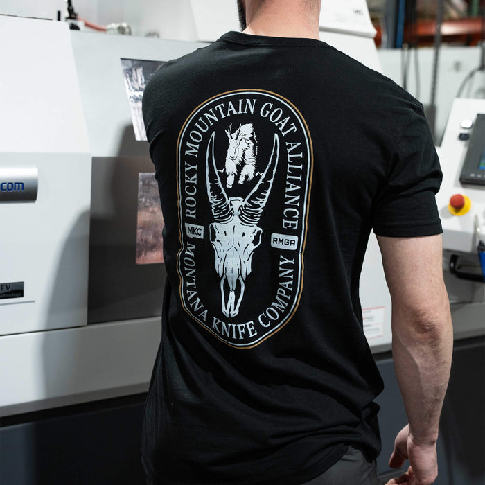 Black t-shirt featuring the Rocky Mountain Goat Alliance logo and Montana Knife Company branding on the back.