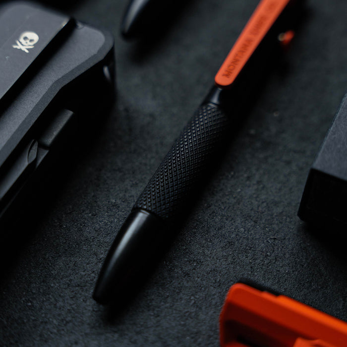 Compact EDC mini pen featuring a textured grip and sleek black design, ideal for everyday carry and outdoor use.