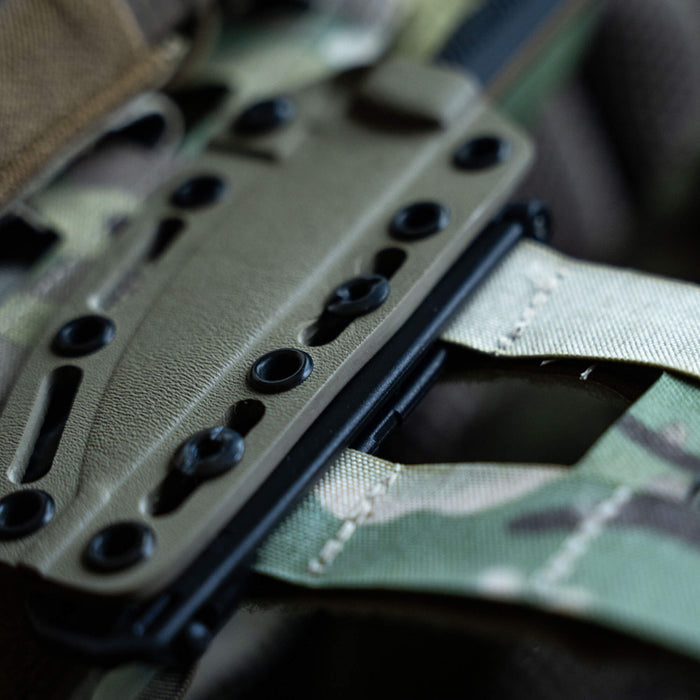 MOLLE-LOK attachment featuring a durable design for secure gear attachment on tactical vests and backpacks.