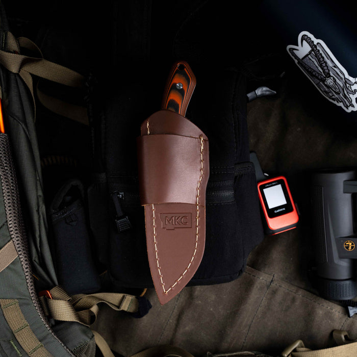 Horizontal belt carry leather sheath for MULE DEER knife, featuring a sleek design and durable construction. Ideal for outdoor use.