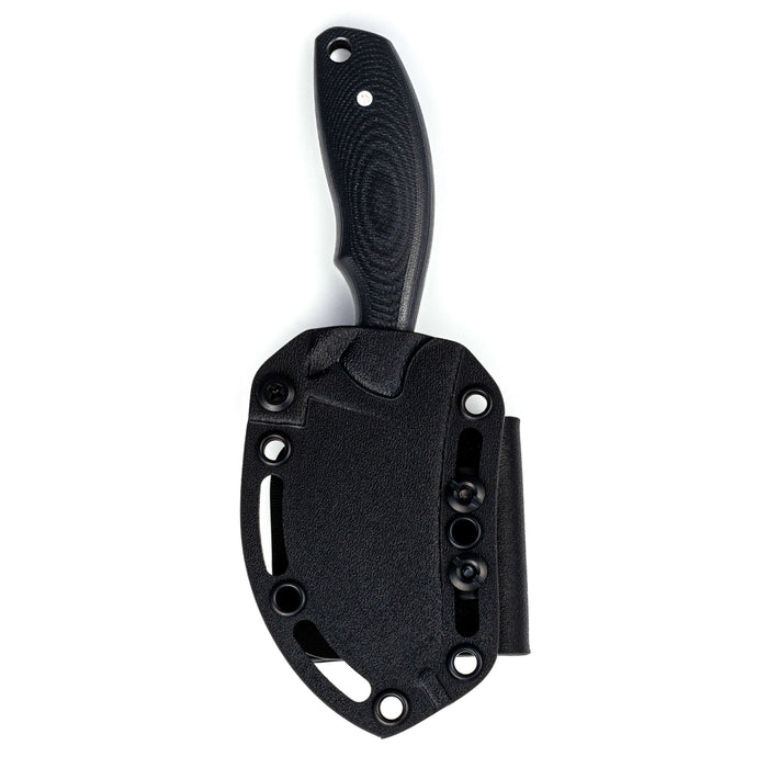 Black PACKOUT SKINNER knife with a textured handle and a protective sheath, designed for outdoor and hunting use.