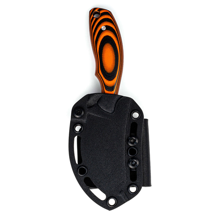 Orange and black PACKOUT SKINNER knife with a textured handle and a black sheath for secure carrying.