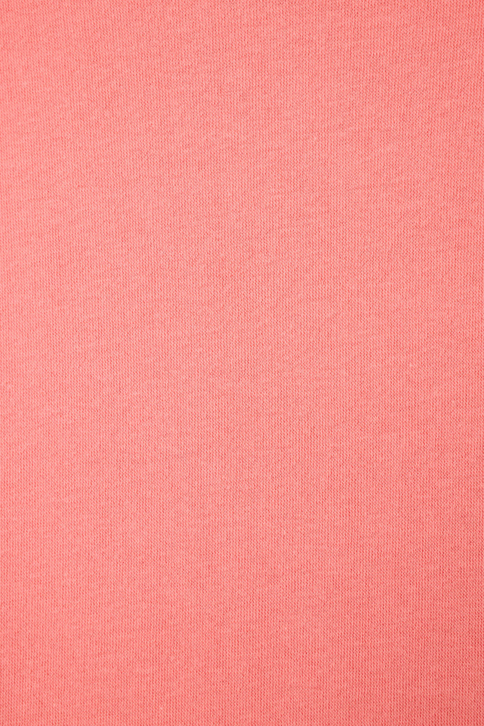 A close-up of the Paloma Mama Cocktails Please Graphic Sweatshirt by P.J. Salvage shows its sunset rose fabric with a smooth, fine knit texture and an even, uniform finish without visible patterns or irregularities.