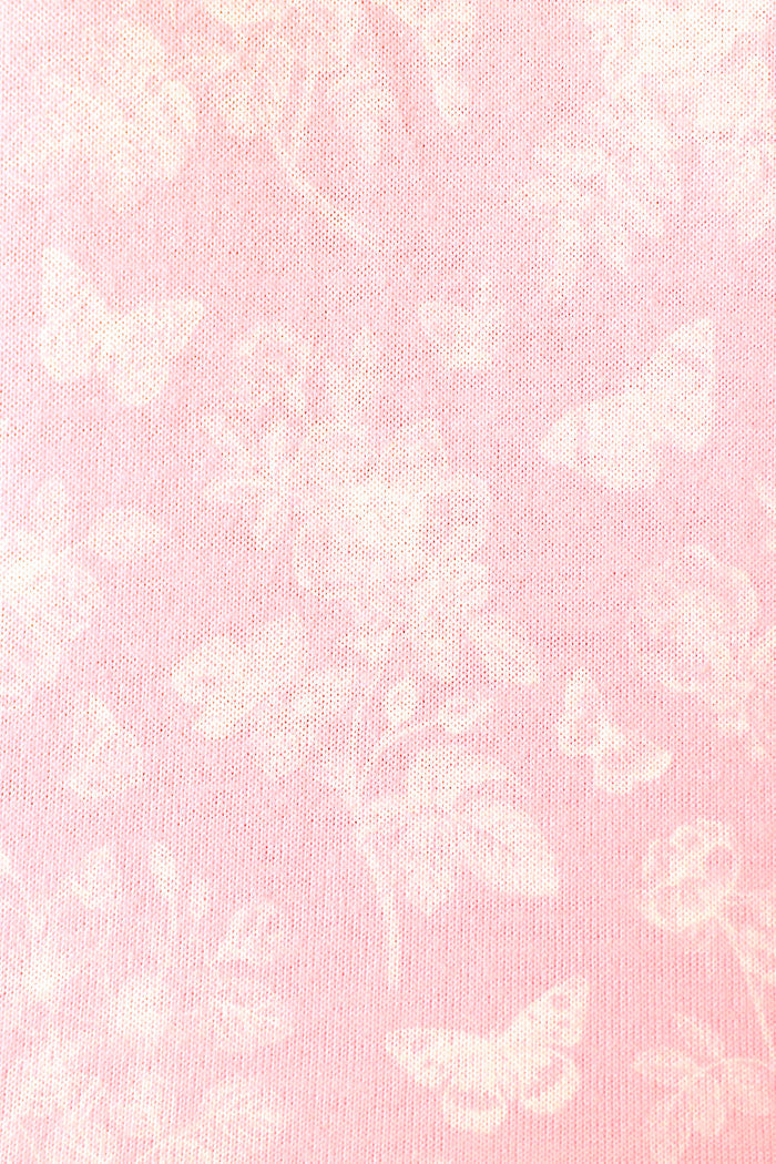 Soft baby pink fabric with white butterfly and floral patterns, creating a delicate, airy appearance.