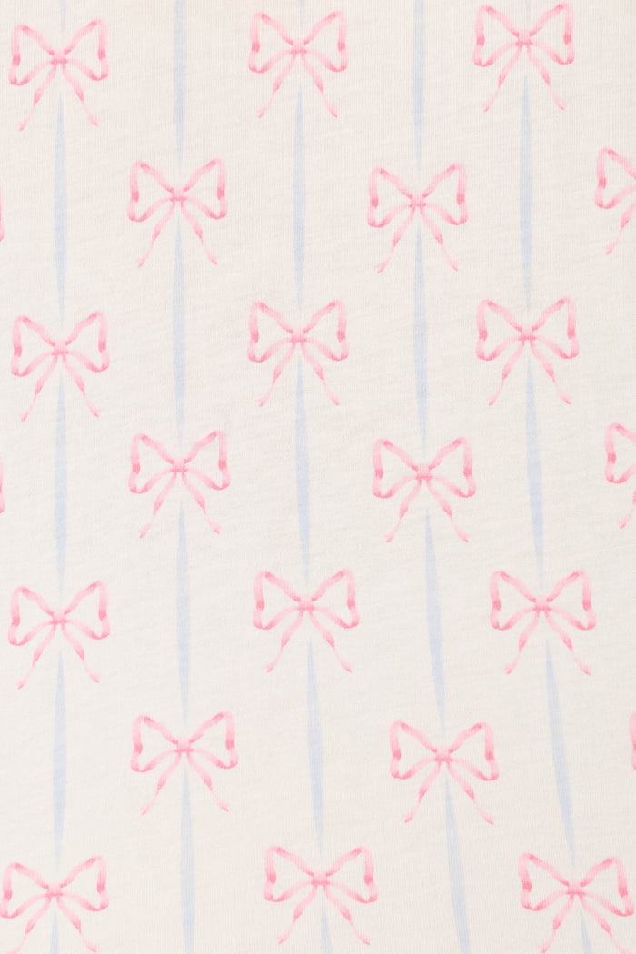 The Playful Prints All Wrapped Up Long PJ Set by P.J. Salvage features evenly spaced pink bows and light blue stripes on an off-white background, adding charming detail to women's sleepwear.