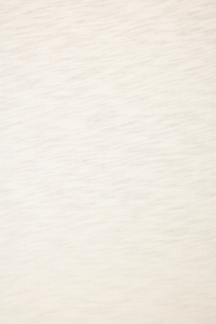 A close-up of the Playful Prints Bon Voyage Graphic Tee by P.J. Salvage shows its light beige cotton-modal jersey with a subtle wavy texture—smooth, uniform, and perfect for a relaxed, minimal look ideal for coastal escapes.