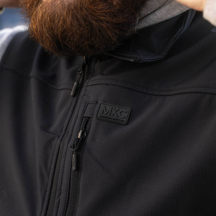 Black Rexford Ripstop Vest from Montana Knife Company, featuring a zippered front and MKC logo, ideal for outdoor activities.
