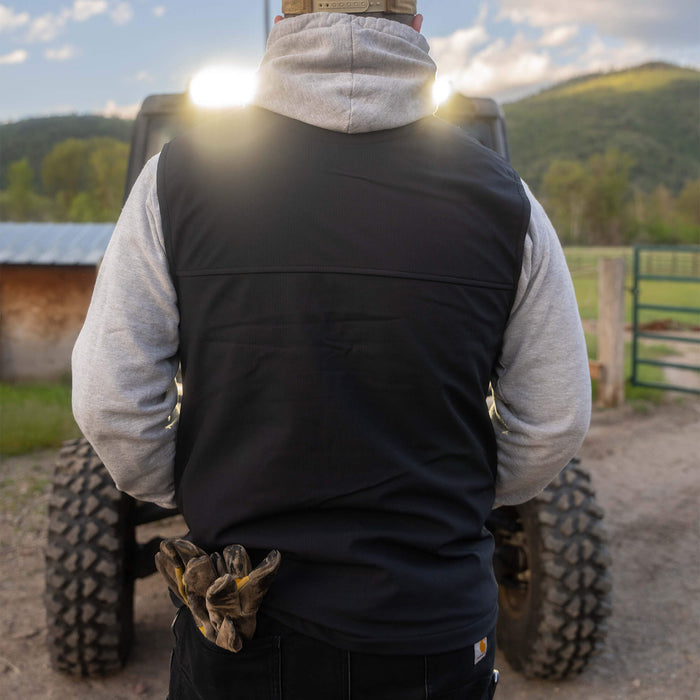 Black Rexford Ripstop Vest worn over a gray hoodie, showcasing a rugged outdoor style suitable for work and leisure.