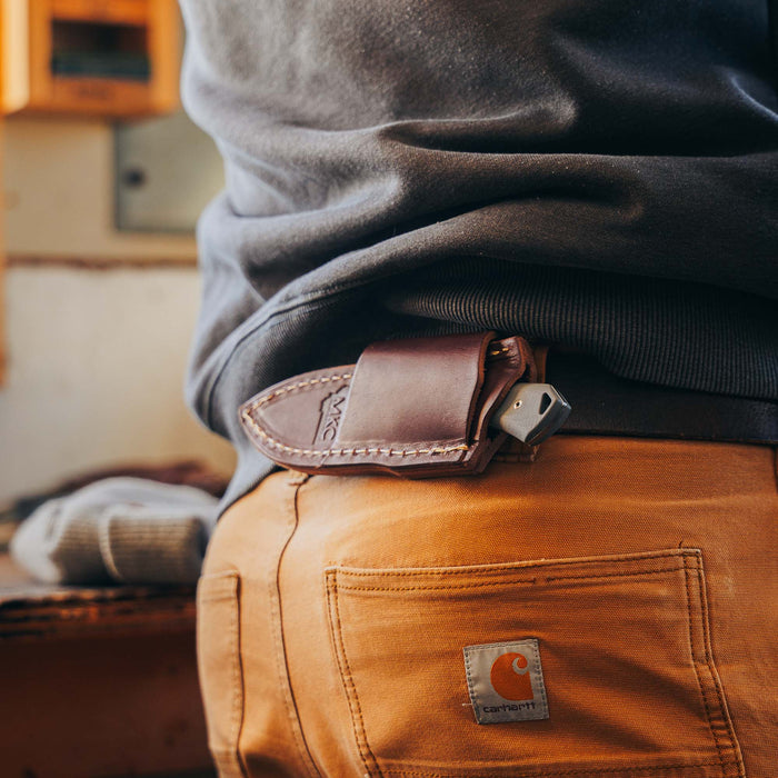 Horizontal leather sheath for secure belt carry, designed for Montana Knife Company's knives, showcasing durability and style.