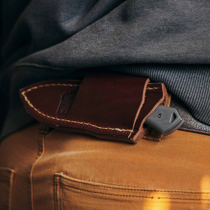 Horizontal leather sheath for secure belt carry, designed for Montana Knife Company's knives, showcasing durability and style.