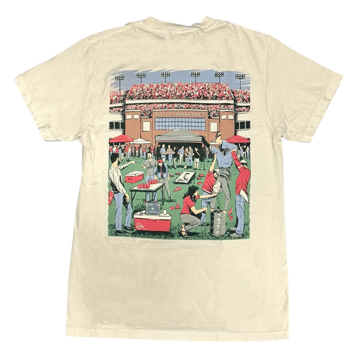 Beige t-shirt with a graphic of people at a stadium on a white background