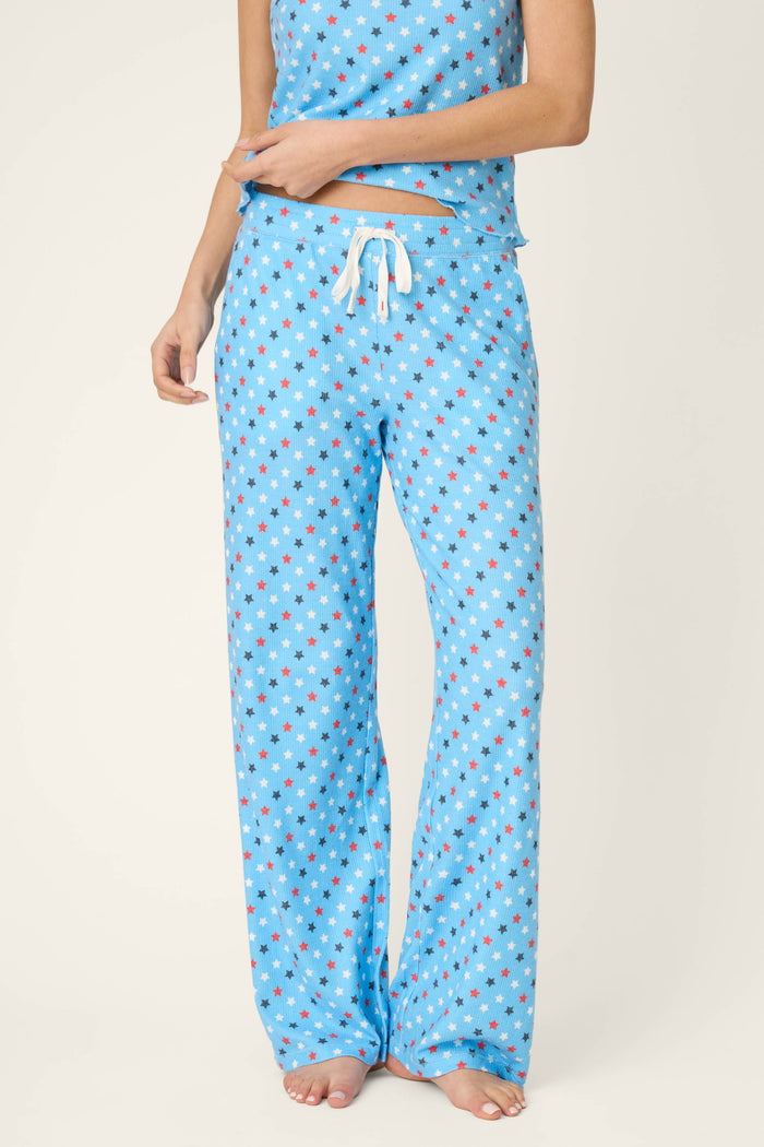 Bay blue fabric with a scattered white star print pattern and white drawstring, soft texture. Matching fabric partially visible.